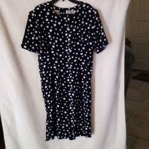 Navy blue with white polka dots and pearl like buttons on front dress.